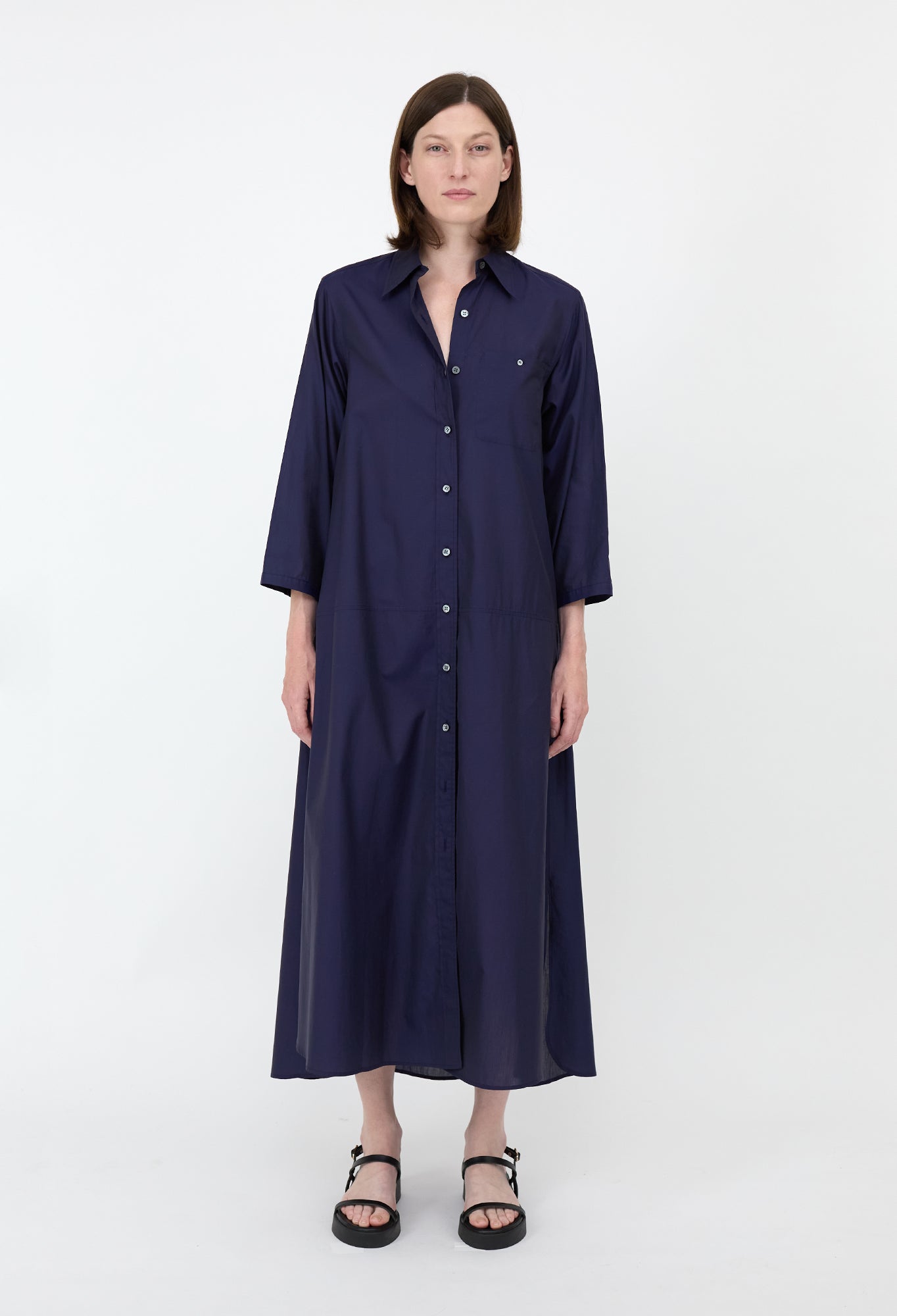 Penelope - A navy blue, long, lightweight shirt dress with a collar and buttons down the front.