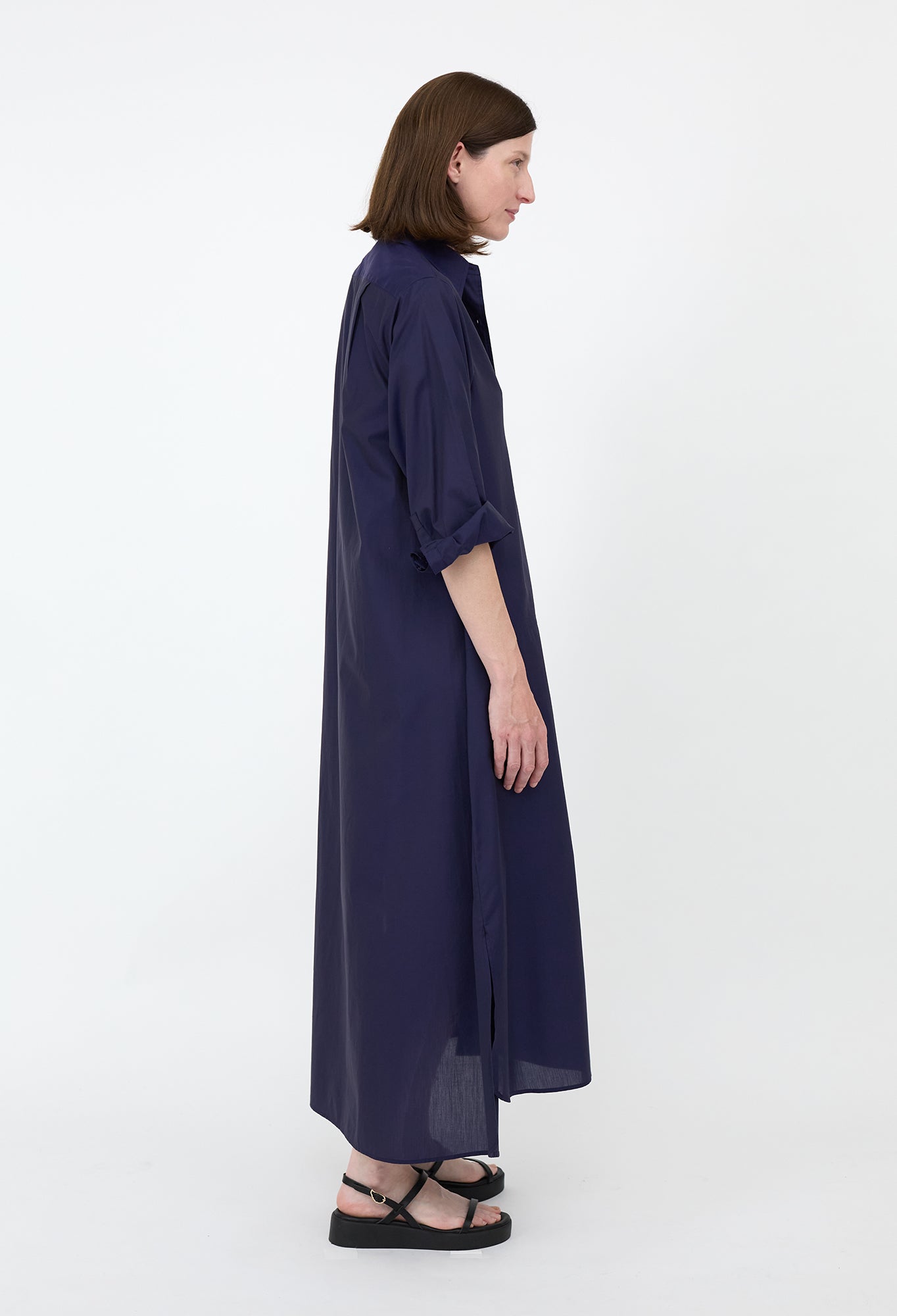 Penelope - A navy blue, long, lightweight shirt dress with a collar and buttons down the front.