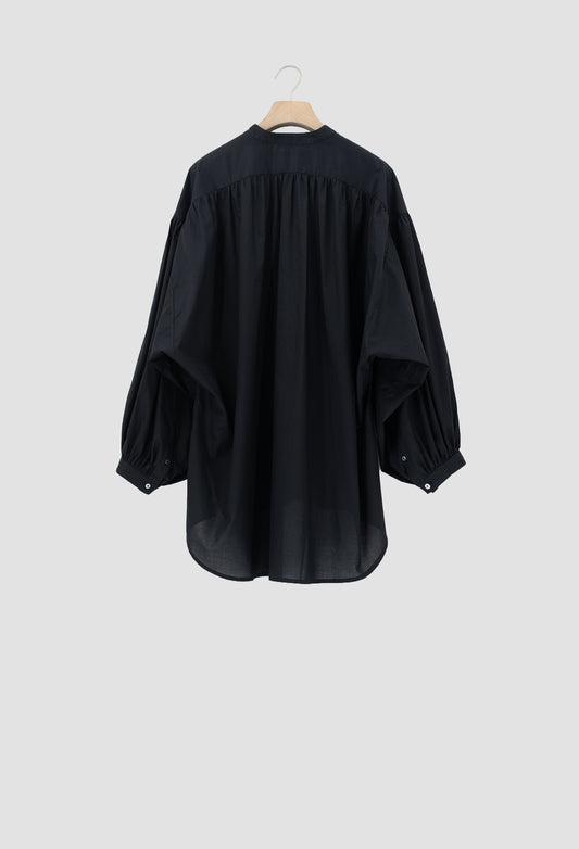 A black long-sleeve blouse with a gathered, balloon-like sleeve design and a high neckline, hanging on a wooden hanger against a light gray background.