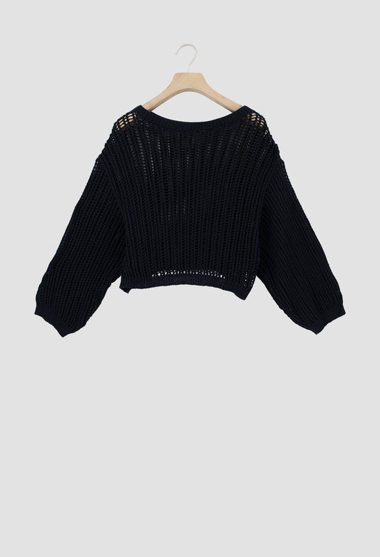 A black ribbed knit cropped sweater with long balloon sleeves and openwork shoulder detailing, hanging on a wooden hanger against a light gray background.