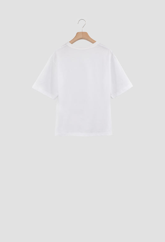 White t-shirt on a wooden hanger against a light gray background