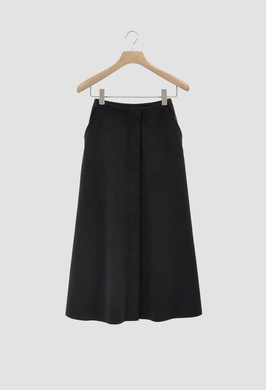 Black skirt on a hanger against a white background