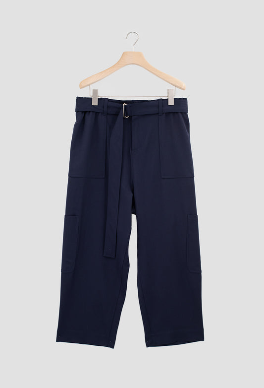 Navy blue pants with a belt on a hanger against a light gray background