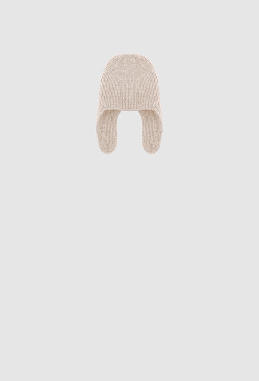 Beige knitted baby hat on a light gray background