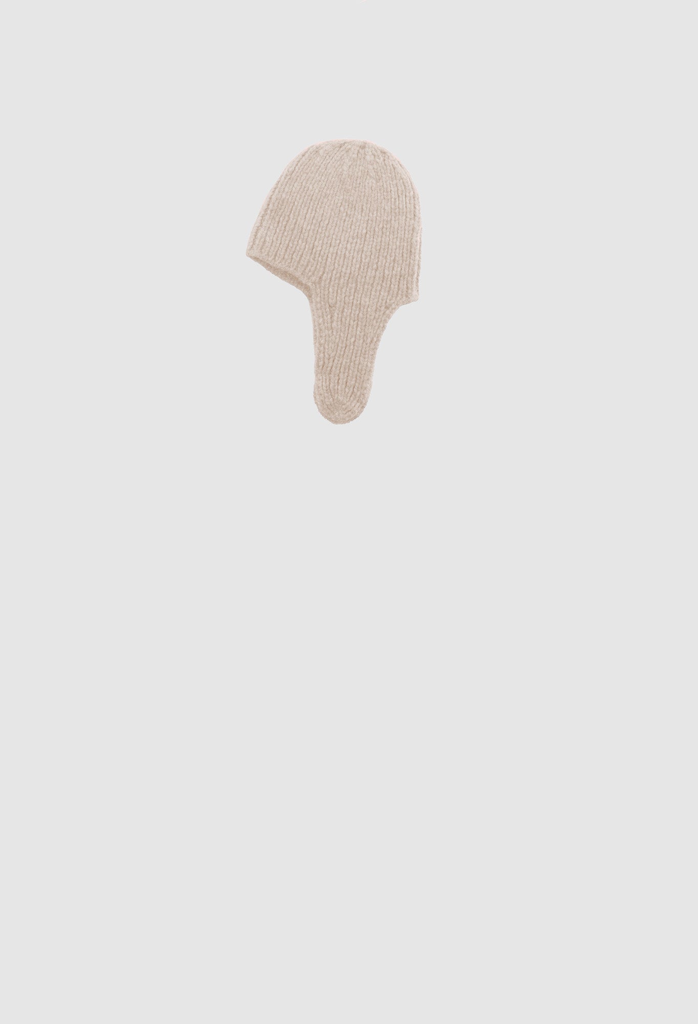 Beige face shield on a light gray background