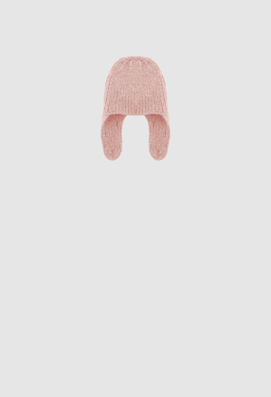 Pink knitted baby hat on a light gray background