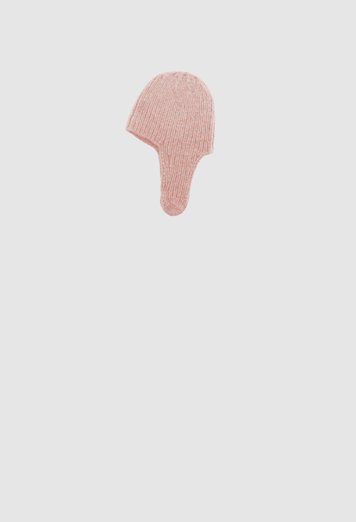 Pink hairbrush on a light gray background
