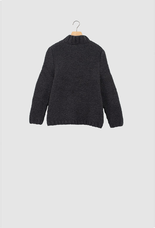 Dark gray sweater on a hanger against a light gray background